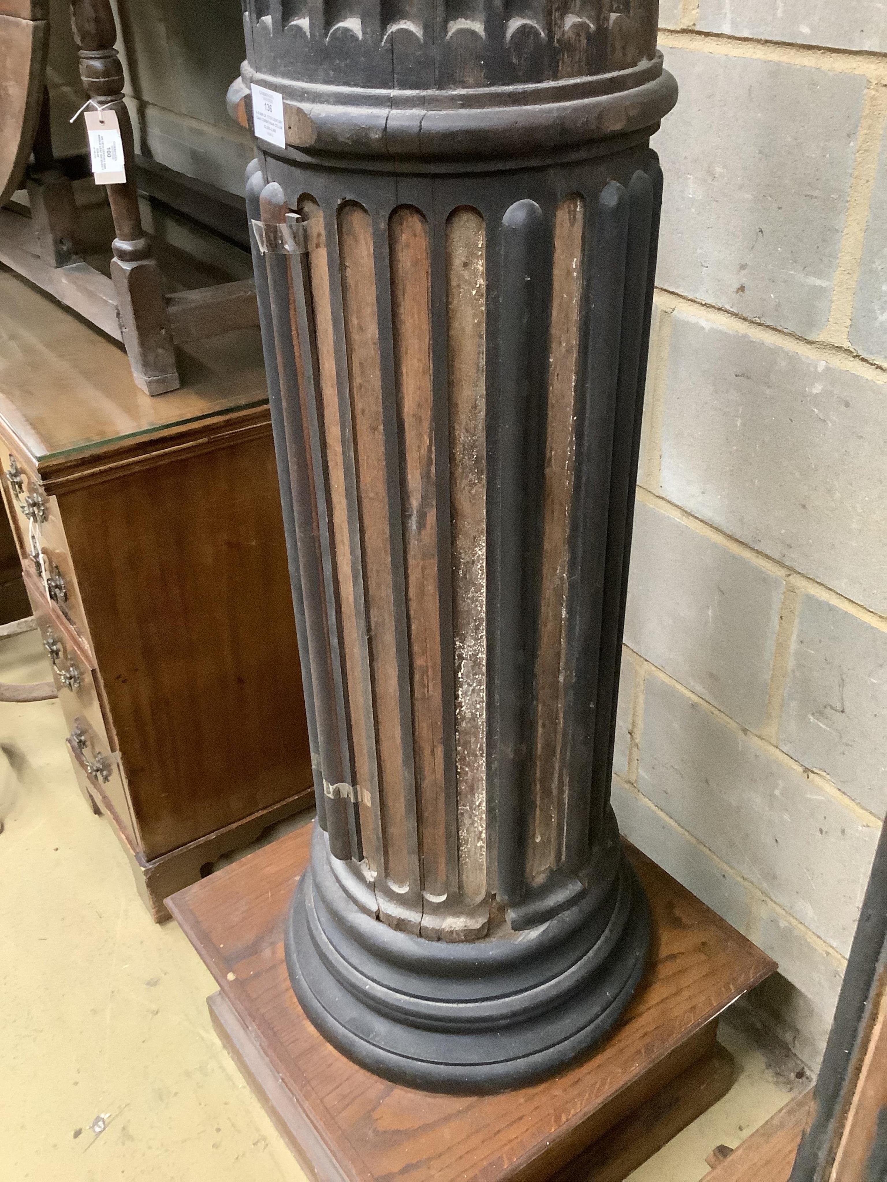 A pair of 17th century oak Corinthian columns, of large size, height 279cm, by repute from St Mary le Bow, designed by Christopher Wren